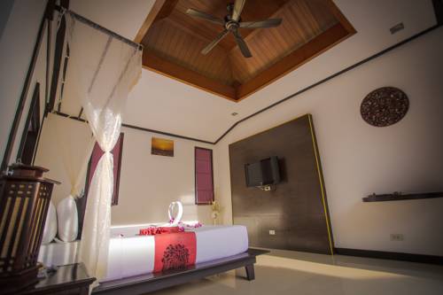 Imagen de la habitación del Hotel The Iris Pool Villa. Foto 14