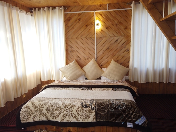 Imagen de la habitación del Hotel The Isisinga. Foto 2