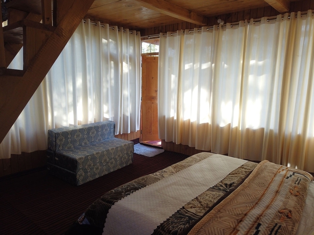 Imagen de la habitación del Hotel The Isisinga. Foto 7