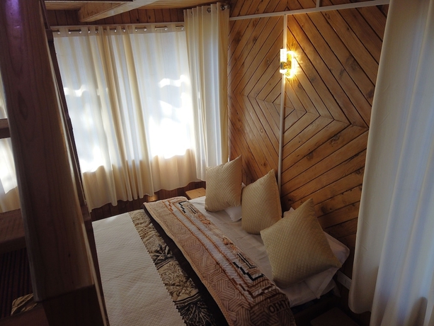 Imagen de la habitación del Hotel The Isisinga. Foto 8