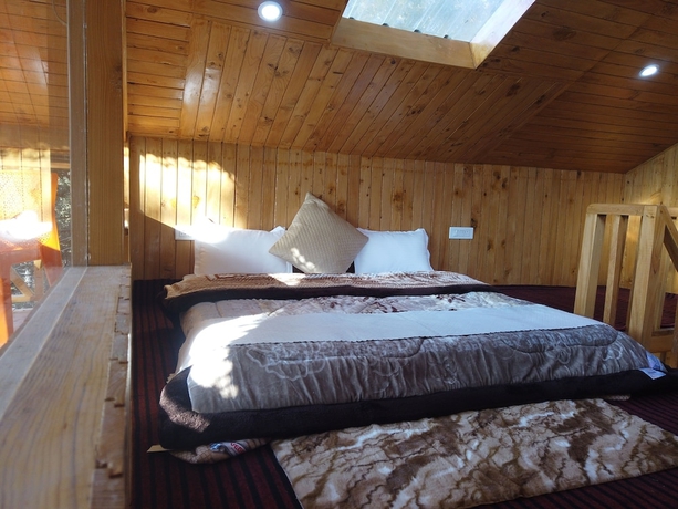 Imagen de la habitación del Hotel The Isisinga. Foto 14