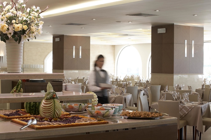 Imagen del bar/restaurante del Hotel The Ixian Grand and All Suites - Adults Only. Foto 2