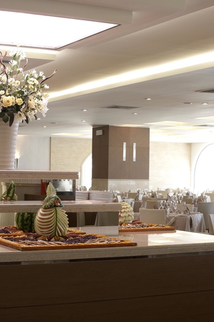 Imagen del bar/restaurante del Hotel The Ixian Grand and All Suites - Adults Only. Foto 3