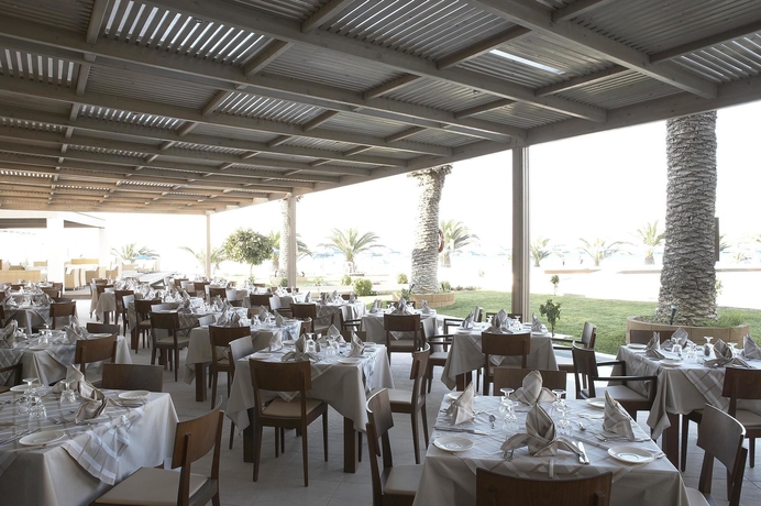 Imagen del bar/restaurante del Hotel The Ixian Grand and All Suites - Adults Only. Foto 4