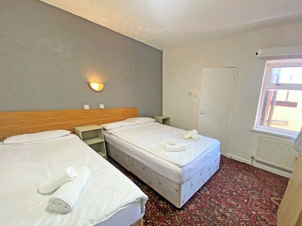 Imagen de la habitación del Hotel The J and S. Foto 20