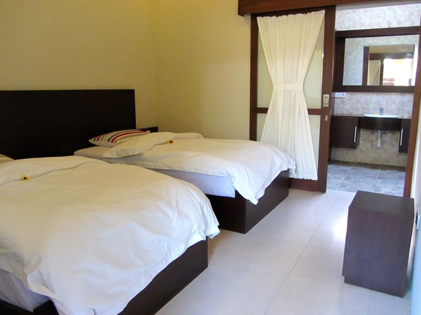 Imagen de la habitación del Hotel The Janan Villa. Foto 12