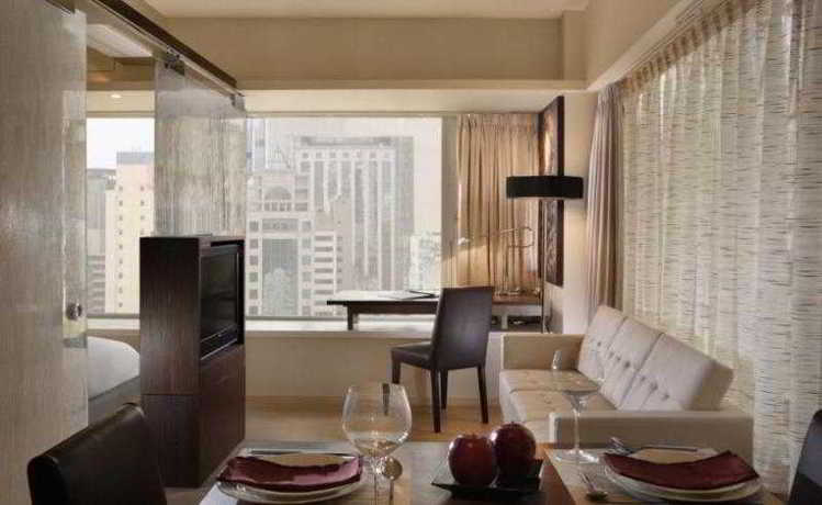 Imagen de la habitación del Hotel The Johnston Suites Hong Kong Serviced Apartments. Foto 1