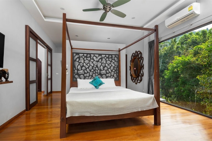 Imagen de la habitación del Hotel The Jungle Club. Foto 17