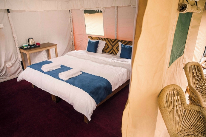 Imagen de la habitación del Hotel The Kamru Riverside Camps and Resorts. Foto 11