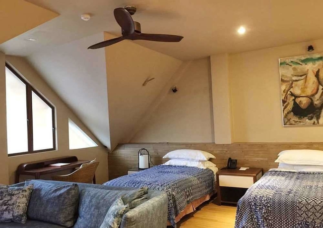 Imagen de la habitación del Hotel The Kasturi. Foto 5