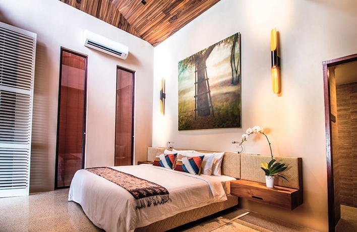 Imagen de la habitación del Hotel The Kasturi. Foto 14