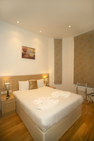 Imagen de la habitación del Hotel The Kensington Studios. Foto 16