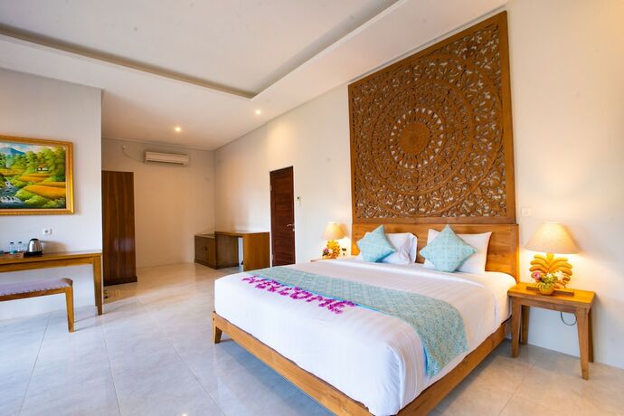 Imagen de la habitación del Hotel The Kirana Tembok. Foto 16