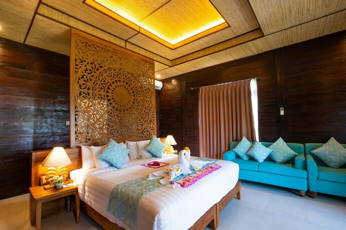 Imagen de la habitación del Hotel The Kirana Tembok. Foto 17