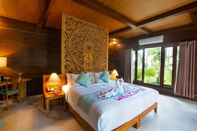 Imagen de la habitación del Hotel The Kirana Tembok. Foto 18