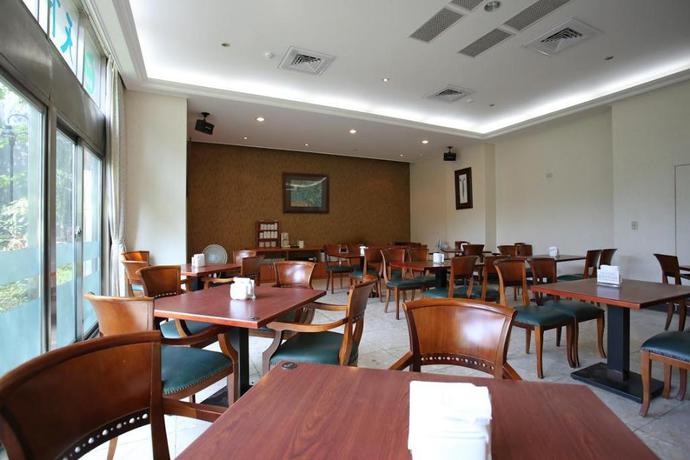 Imagen del bar/restaurante del Hotel The Koos Hotel. Foto 7