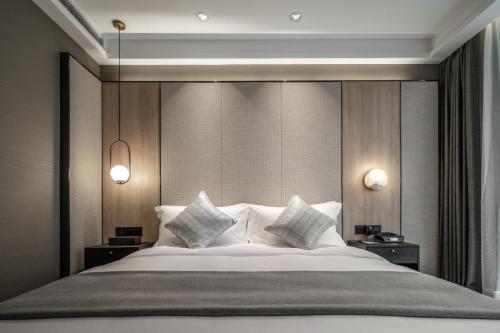 Imagen de la habitación del Hotel The Kuan. Foto 9