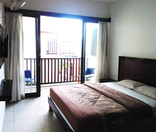 Imagen de la habitación del Hotel The Kubu Hotel. Foto 12