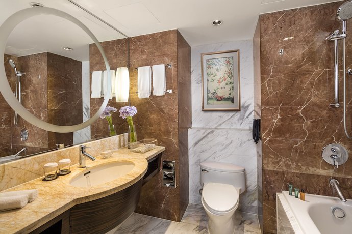 Imagen de la habitación del Hotel The Kunlun Jing An. Foto 10