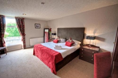 Imagen de la habitación del Hotel The Kylestrome. Foto 2