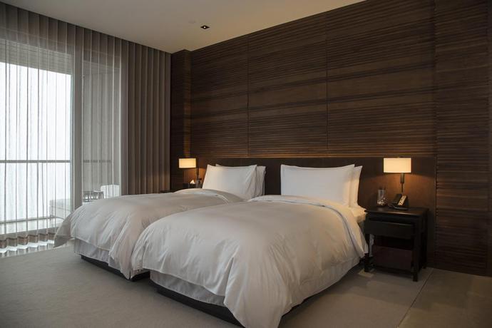 Imagen de la habitación del Hotel The Lalu Qingdao China. Foto 10
