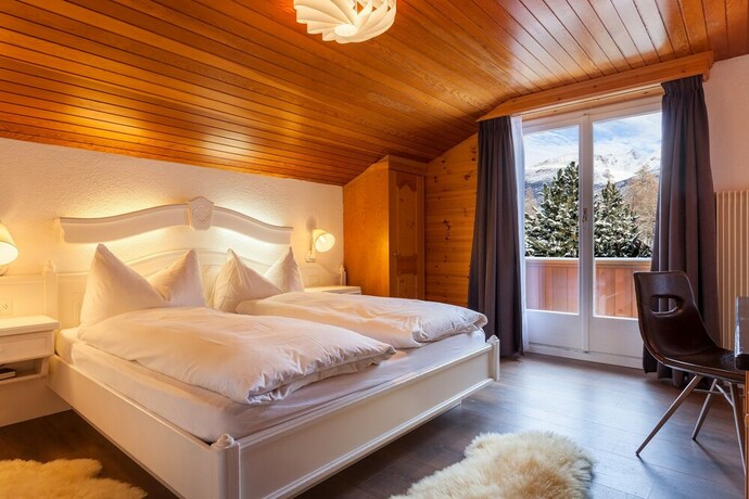 Imagen de la habitación del Hotel The Larix, Saas-Fee. Foto 14