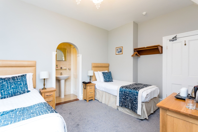 Imagen de la habitación del Hotel The Lawn Guest House. Foto 3