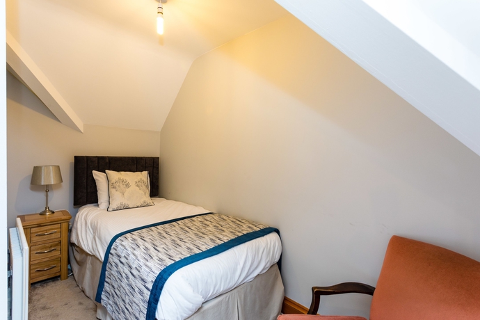 Imagen de la habitación del Hotel The Lawn Guest House. Foto 7