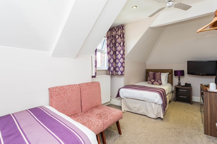 Imagen de la habitación del Hotel The Lawn Guest House. Foto 11