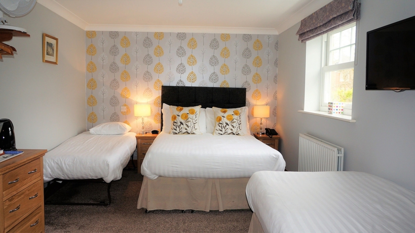 Imagen de la habitación del Hotel The Lawn Guest House. Foto 12