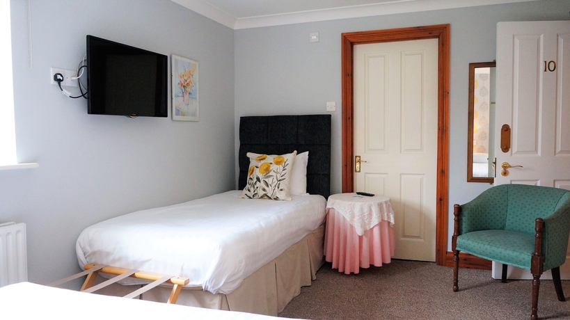 Imagen de la habitación del Hotel The Lawn Guest House. Foto 13