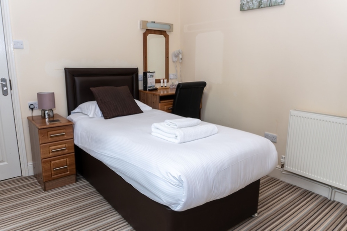 Imagen de la habitación del Hotel The Lawns Guest House. Foto 10