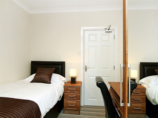 Imagen de la habitación del Hotel The Lawns Guest House. Foto 11