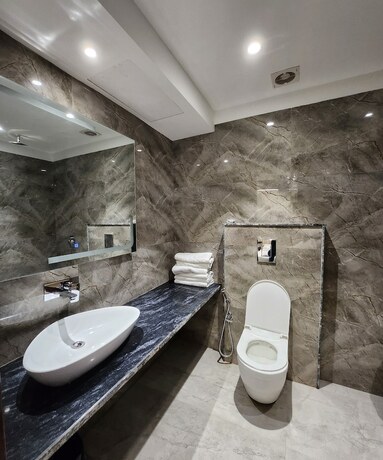 Imagen de la habitación del Hotel The Leena International - New Delhi. Foto 18