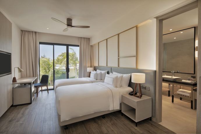 Imagen de la habitación del Hotel The Level Villas at Melia Ho Tram Beach Resort. Foto 19