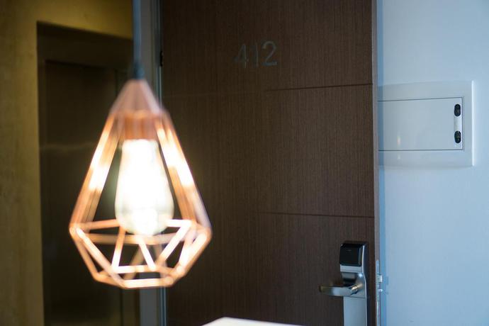 Imagen de la habitación del Hotel The Lights City Rooms. Foto 11