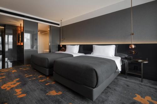 Imagen de la habitación del Hotel The Linow Hotel Xi'an. Foto 4