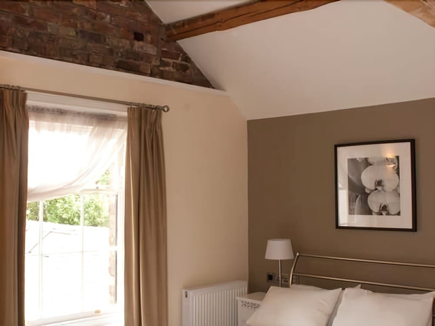 Imagen de la habitación del Hotel The Lion. Foto 9