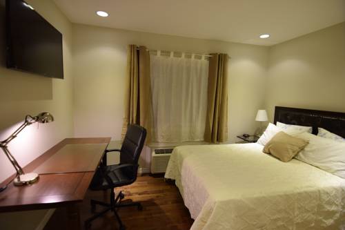 Imagen de la habitación del Hotel The Lion Inn and Suites. Foto 5