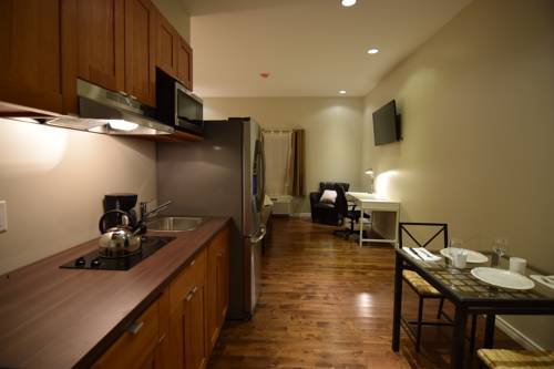 Imagen de la habitación del Hotel The Lion Inn and Suites. Foto 6
