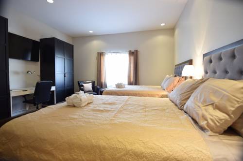 Imagen de la habitación del Hotel The Lion Inn and Suites. Foto 9