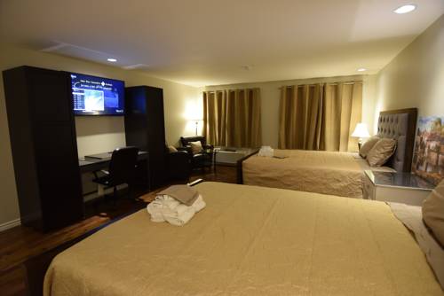 Imagen de la habitación del Hotel The Lion Inn and Suites. Foto 12
