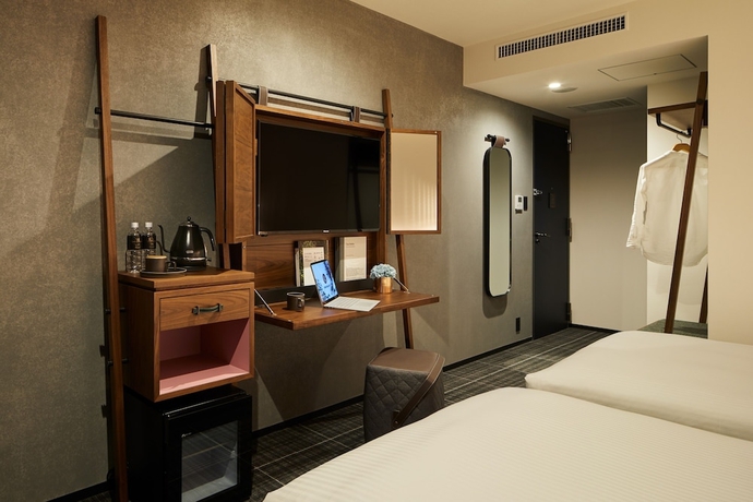 Imagen de la habitación del Hotel The Lively Tokyo Azabujuban. Foto 12