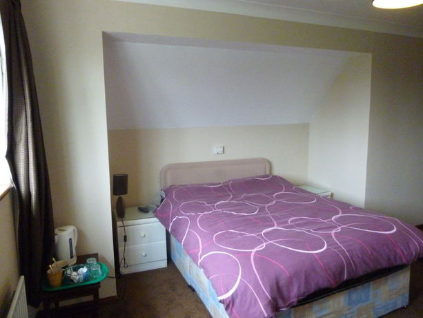 Imagen de la habitación del Hotel The Lodge Guesthouse. Foto 4