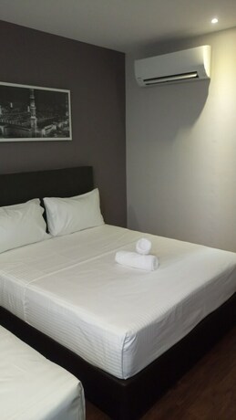 Imagen de la habitación del Hotel The Loft Plaza. Foto 17