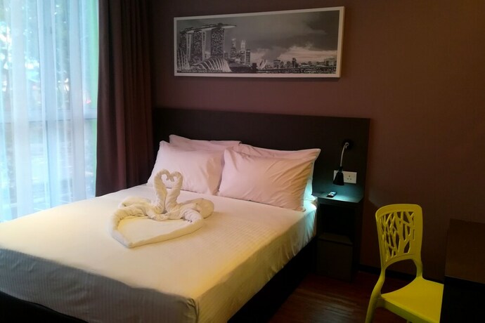 Imagen de la habitación del Hotel The Loft Plaza. Foto 18