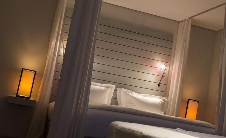 Imagen de la habitación del Hotel The Lombok Lodge Suites and Private Villas. Foto 7