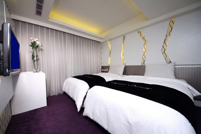 Imagen de la habitación del Hotel The Longstay. Foto 6