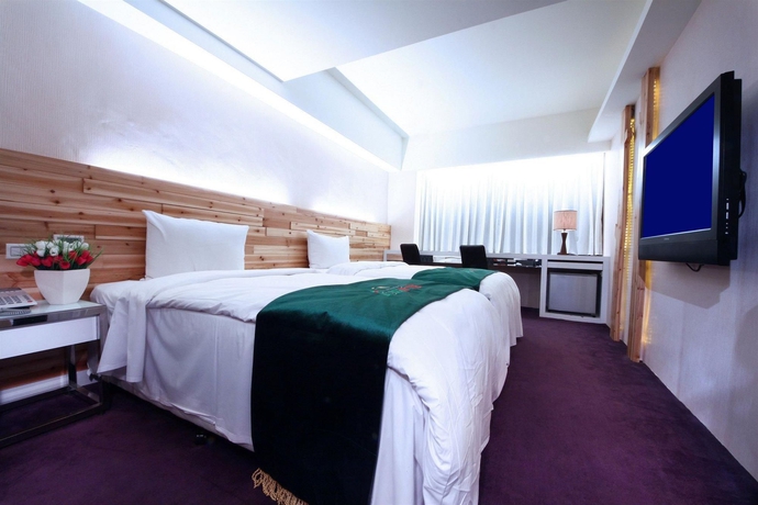Imagen de la habitación del Hotel The Longstay. Foto 7