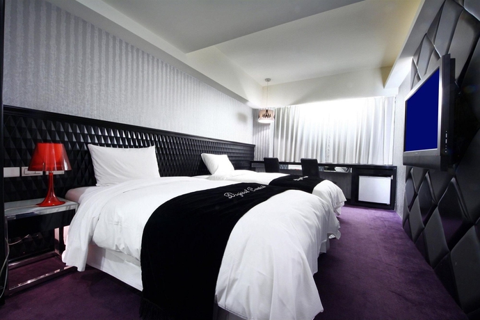 Imagen de la habitación del Hotel The Longstay. Foto 9